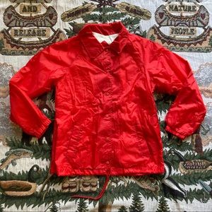 Bright red fleece-lined windbreaker
